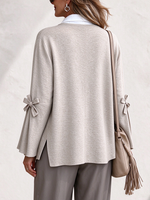 Elegante cardigan lavorato a maglia con maniche a fiocco