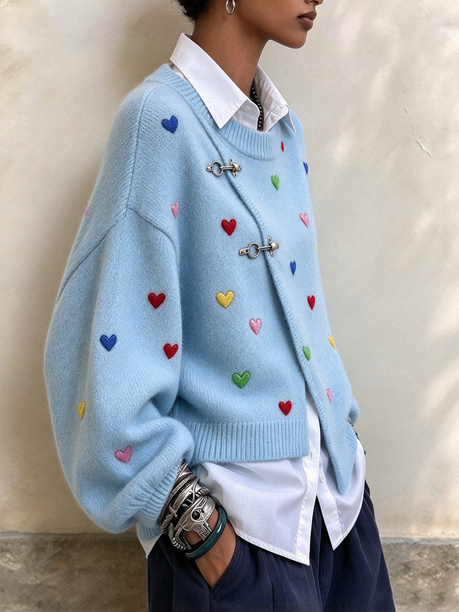 Jersey elegante asimétrico en mezcla de lana con bordado de corazones