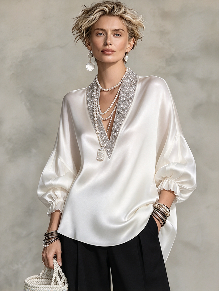 Elegante camicetta formale in raso decorata con scintillanti