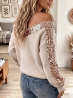 Maglione da donna in maglia con scollo a V con spalle scoperte e finiture in paillettes oro rosa