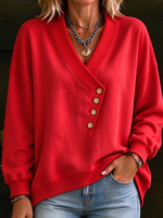 Sudadera holgada asimétrica con botones