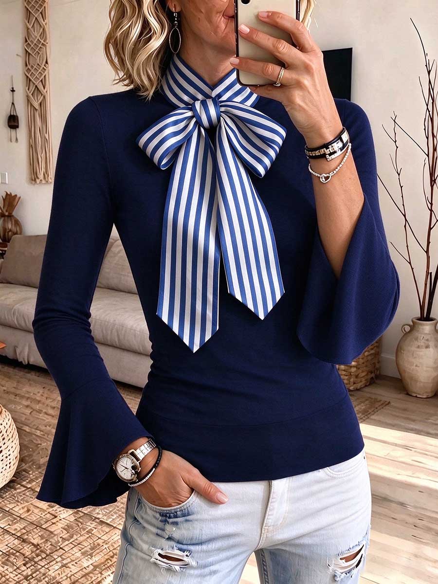 Elegante blusa azul marino para mujer con pajarita a rayas y mangas acampanadas