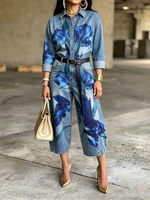 Artistic Denim Jumpsuit With Bold Blue Floral Print