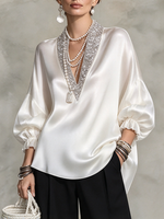 Elegante camicetta formale in raso decorata con scintillanti