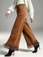 Pantaloni larghi in pelle scamosciata con frange chic