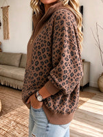 Top casual de punto con media cremallera y estampado de leopardo