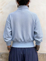 Damen-Pullover mit Waffelmuster und Schnürsaum und asymmetrischem Ausschnitt