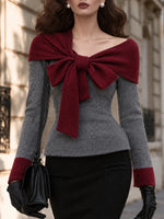 Elegante top in maglia con spalle scoperte color block e dettaglio fiocco