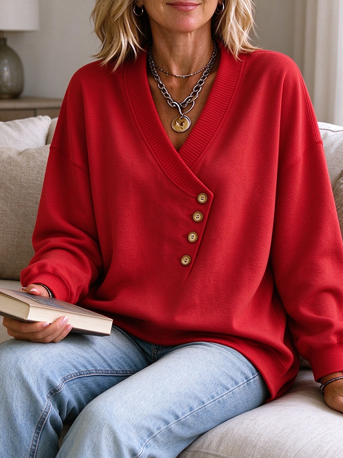 Sudadera holgada asimétrica con botones