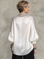 Elegante camicetta formale in raso decorata con scintillanti