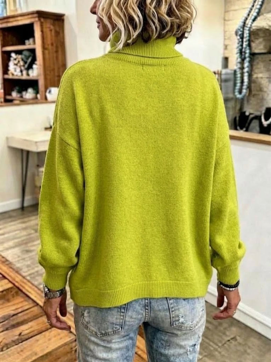 Jersey holgado de punto con cuello alto y fila diagonal de botones de colores