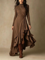 Elegante vestido midi de punto asimétrico con detalle retorcido que define la cintura