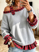 Sudadera informal elegante con hombros descubiertos y paneles a cuadros