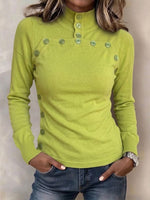Schmal geschnittenes Strickoberteil mit Stehkragen und Knopfdetails