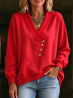 Sudadera holgada asimétrica con botones