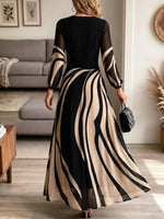 Abito lungo elegante a maniche lunghe velato a righe astratte da donna