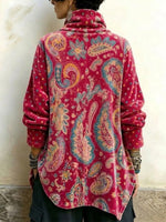Top a collo alto in velluto con stampa cachemire vintage e design asimmetrico con bottoni sul davanti