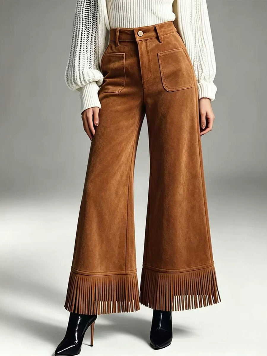Pantaloni larghi in pelle scamosciata con frange chic