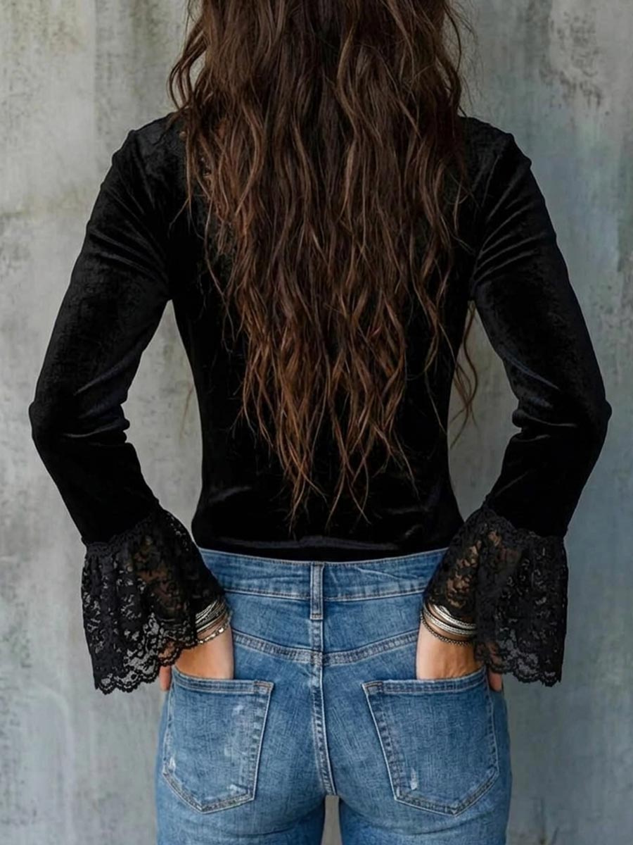 Elegante top de terciopelo negro con cuello en V y ribete de encaje floral