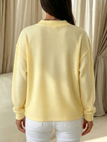 Cozy Casual Chic: Soft Yellow Waffle Knit Top