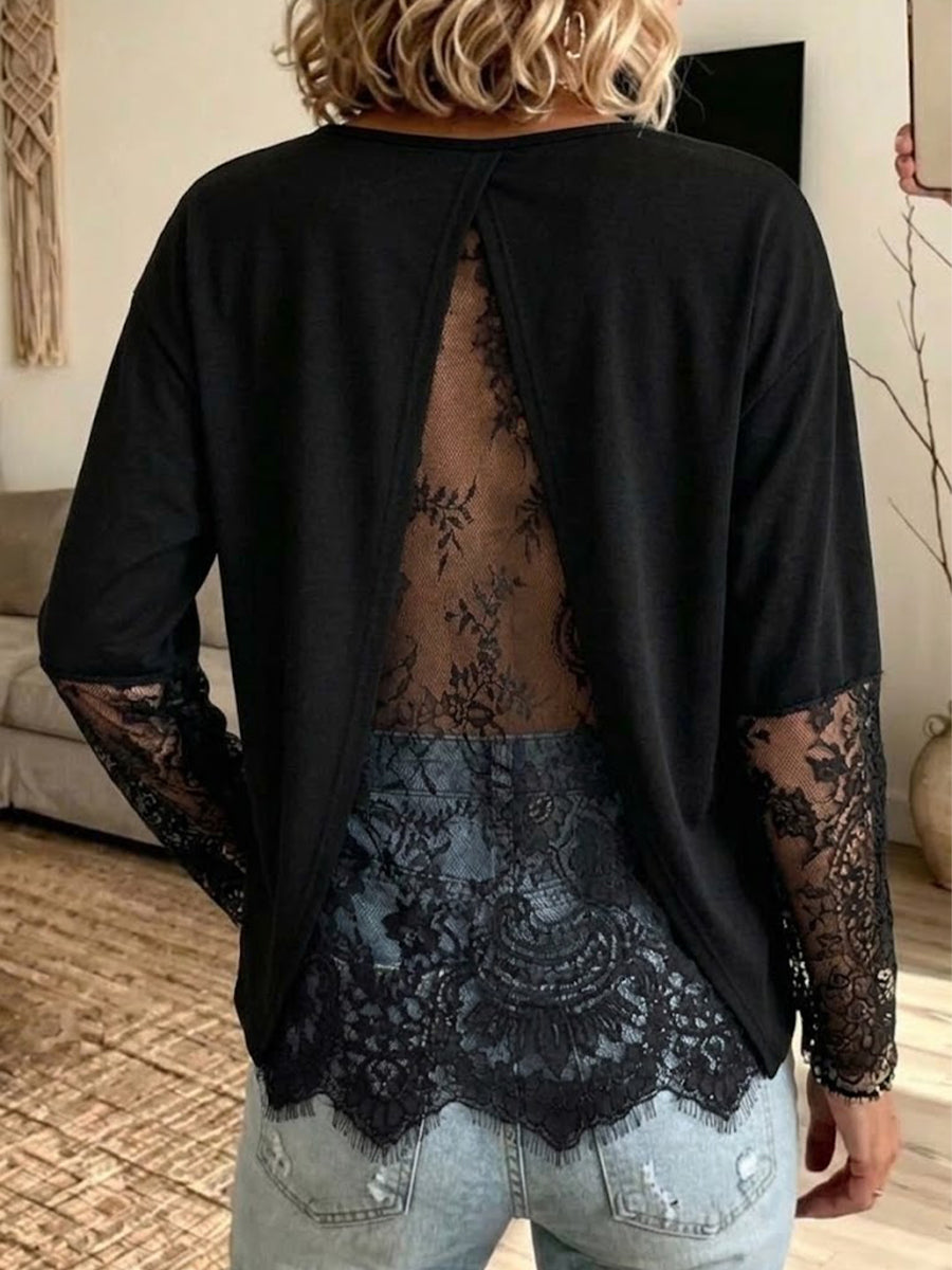 Top a maniche lunghe con pannelli in pizzo e spacco sul retro