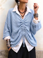 Cozy, Relaxed-fit Knit Top With A V-neck And Gathered Front Detail.