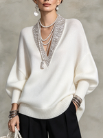 Eleganter luxuriöser Strickpullover mit V-Ausschnitt und Paillettenbesatz