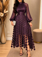 Elegantes Patchworkkleid mit Quasten
